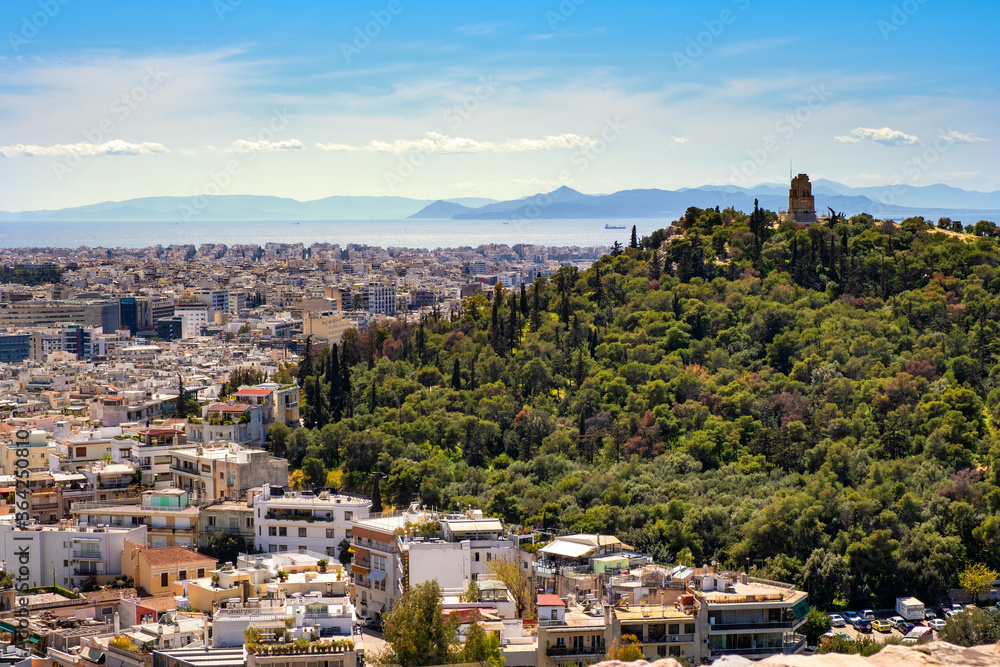 Panoramic view of metropolitan Athens with Philopappos Monument and Philopappou Hill - Mouseion Hill - seen from Acropolis hill in Athens, Greece