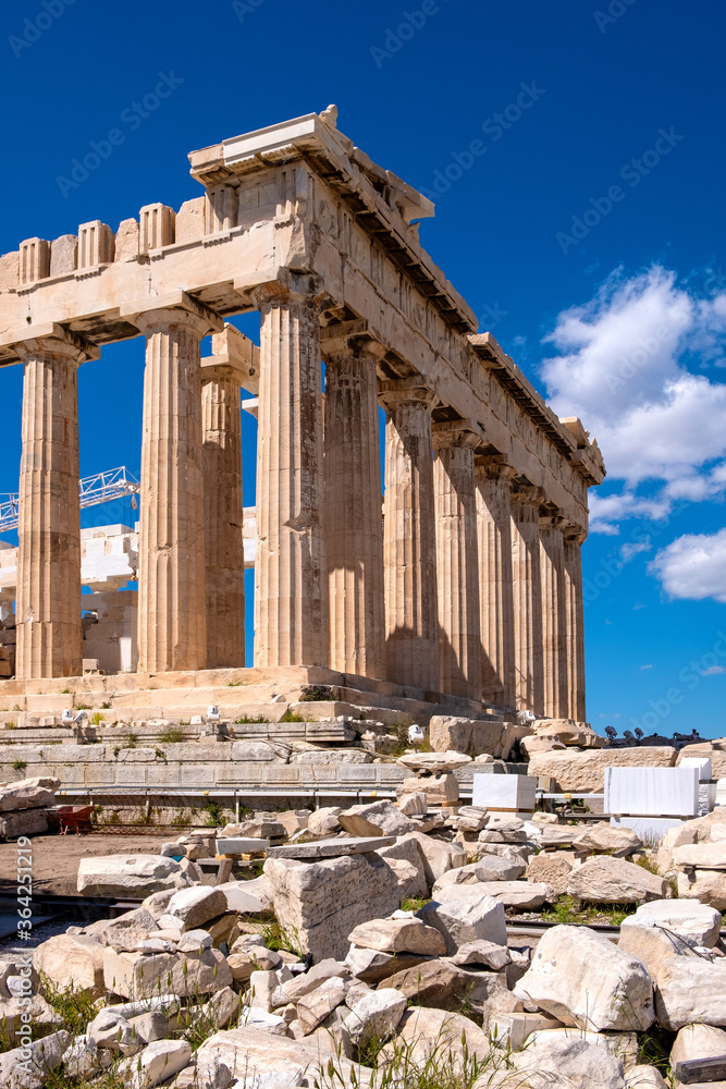 Panoramic view of Parthenon - temple of goddess Athena - within ancient Athenian Acropolis complex atop Acropolis hill in Athens, Greece Panoramic view of Parthenon - temple of goddess Athena - within ancient Athenian Acropolis complex atop Acropolis hill in Athens, Greece