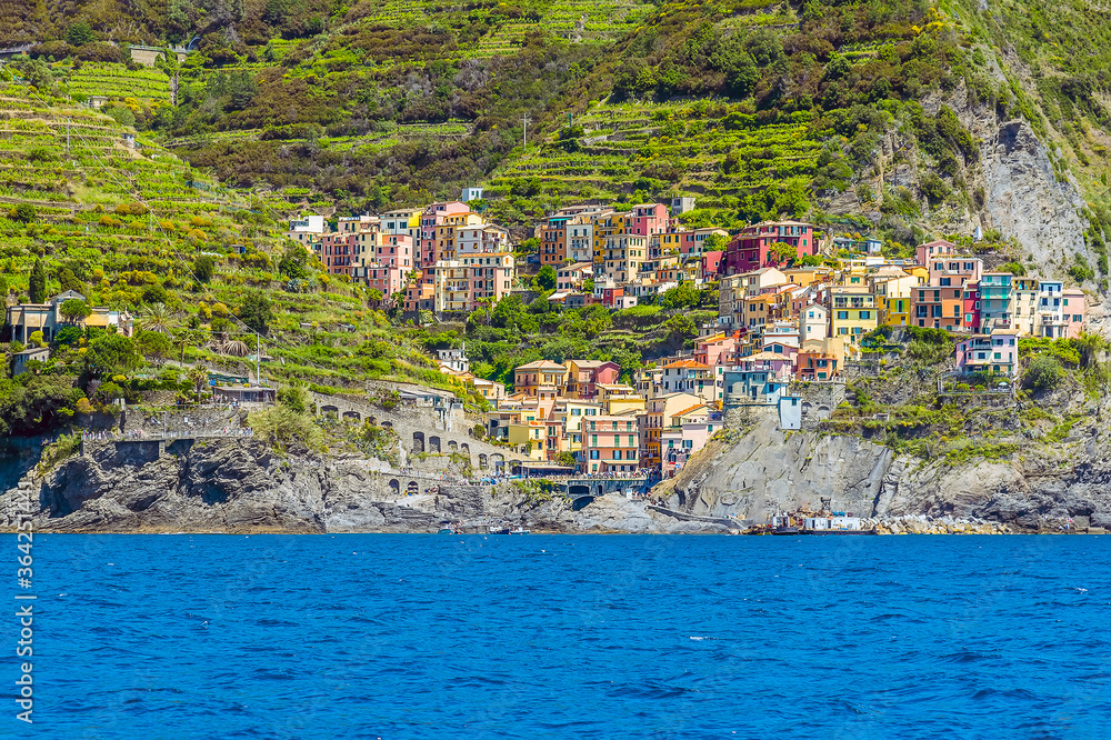 A view from the sea up the main street of the Cinque Terre village of Manarola, Italy in the summertime