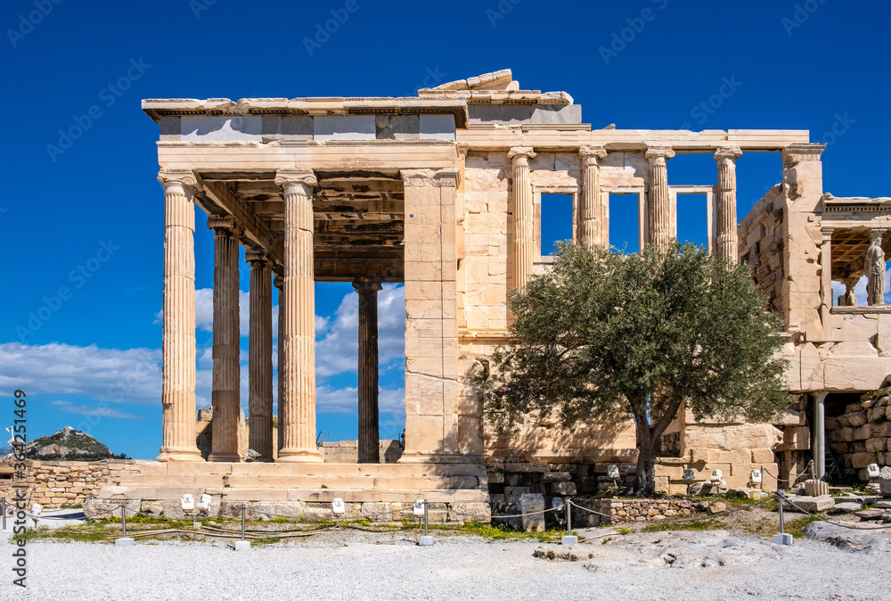 Panoramic view of Erechtheion or Erechtheum - temple of Athena and Poseidon - within ancient Athenian Acropolis complex atop Acropolis hill in Athens, Greece