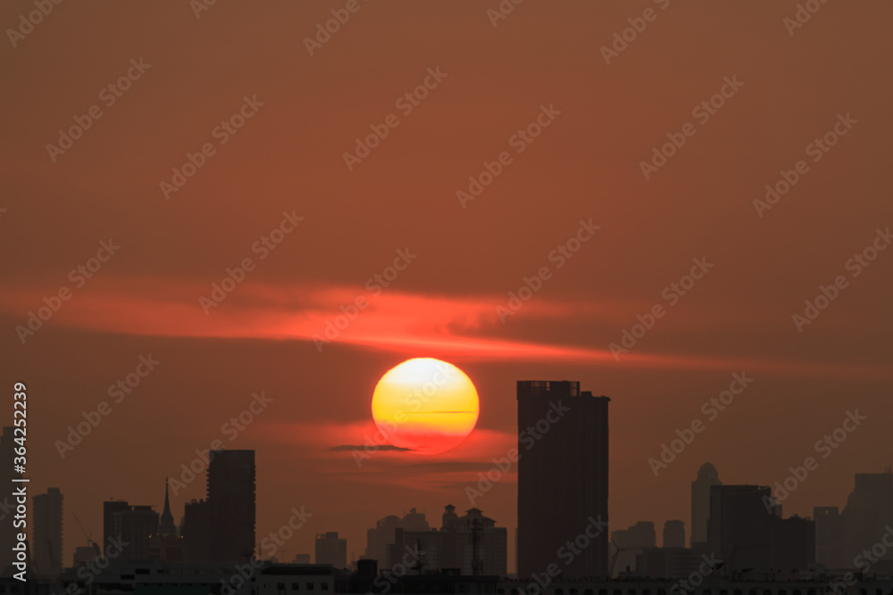 Sunset  with cityscape of building silhouette,At  twilight  in Bangkok ,Thailand
