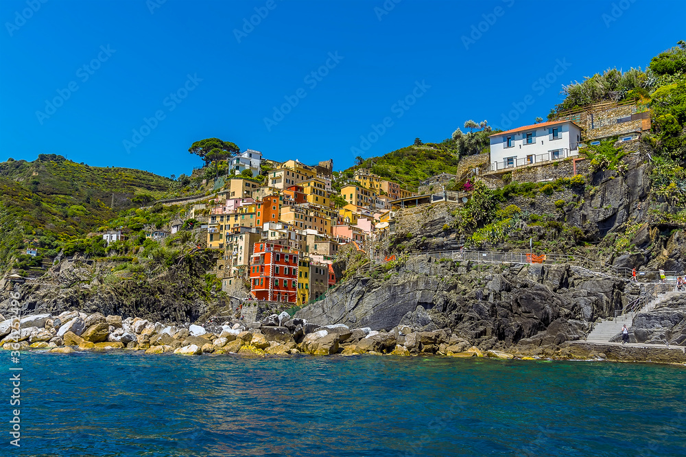 Approaching the landing stage for the Cinque Terre village of Riomaggiore, Italy in the summertime