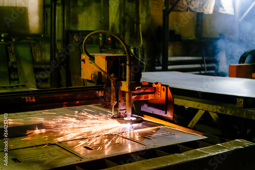Plasma cutting of metal. Plasma cutting machine. CNC plasma cutting machine.