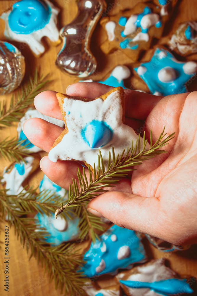 Homemade delicious gingerbread with blue and white glaze. Baking with your own hands. Christmas background.