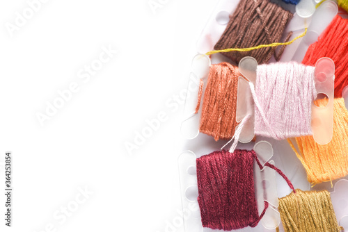 Colorful of thread for sewing on white background photo