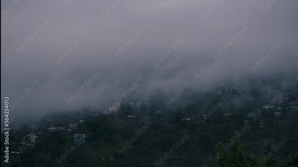 Time-lapse of Clouds covering an entire city Kohima on top of a hilly region in the mountains of Nagaland shot in 4k. Time-lapse of Clouds covering an entire city Kohima on top of a hilly region in the mountains of Nagaland shot in 4k.