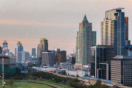 Bangkok city with modern high building at business district around the park.