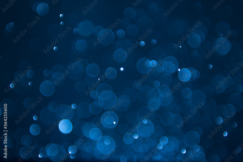abstract sparkle bokeh light effect with navy blue background abstract sparkle bokeh light effect with navy blue background