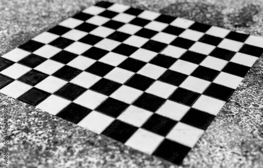 Fototapeta premium Black and white ceramic tiles in checkerboard pattern