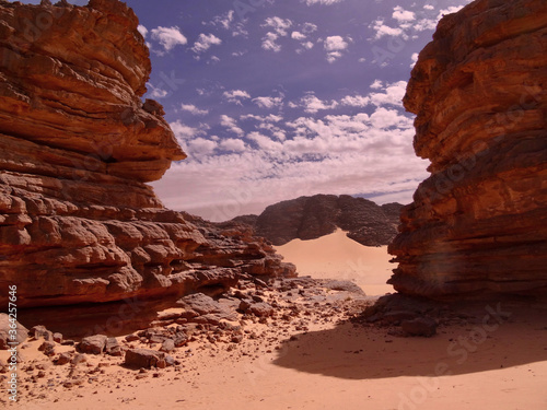 landscape of sands surrounded by rocks 