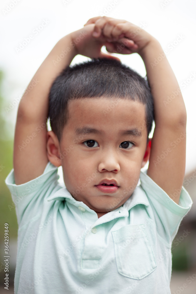 headshot of asian children looking to camera headshot of asian children looking to camera