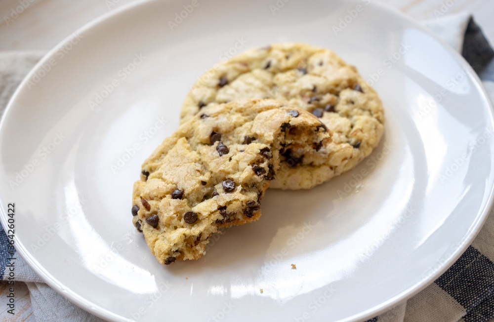 fresh baked classic chocolate chip cookies with nuts on a plate fresh baked classic chocolate chip cookies with nuts on a plate