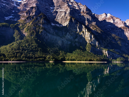 Swiss mountains and Lake. Scenic Alps and lane view. Trekking an