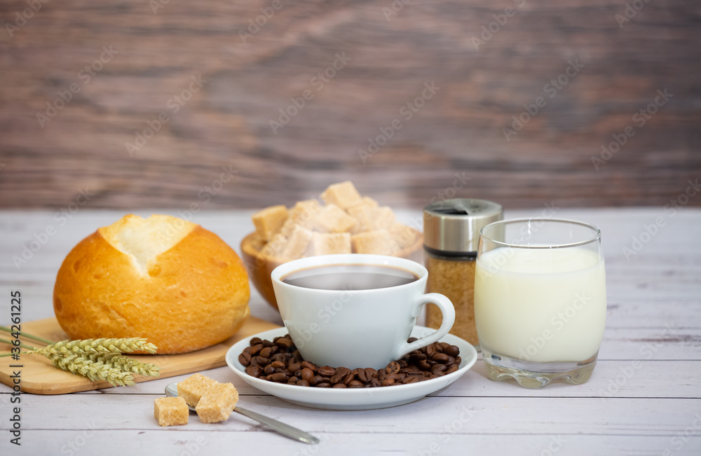 Breakfast in the morning with black coffee cup with bread with Croissant and fruit on the wooden table. Breakfast in the morning with black coffee cup with bread with Croissant and fruit on the wooden table.
