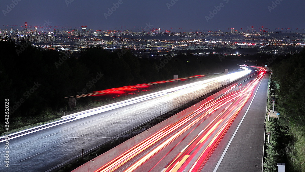 Obraz premium city and freeway at night panorama with long exposure