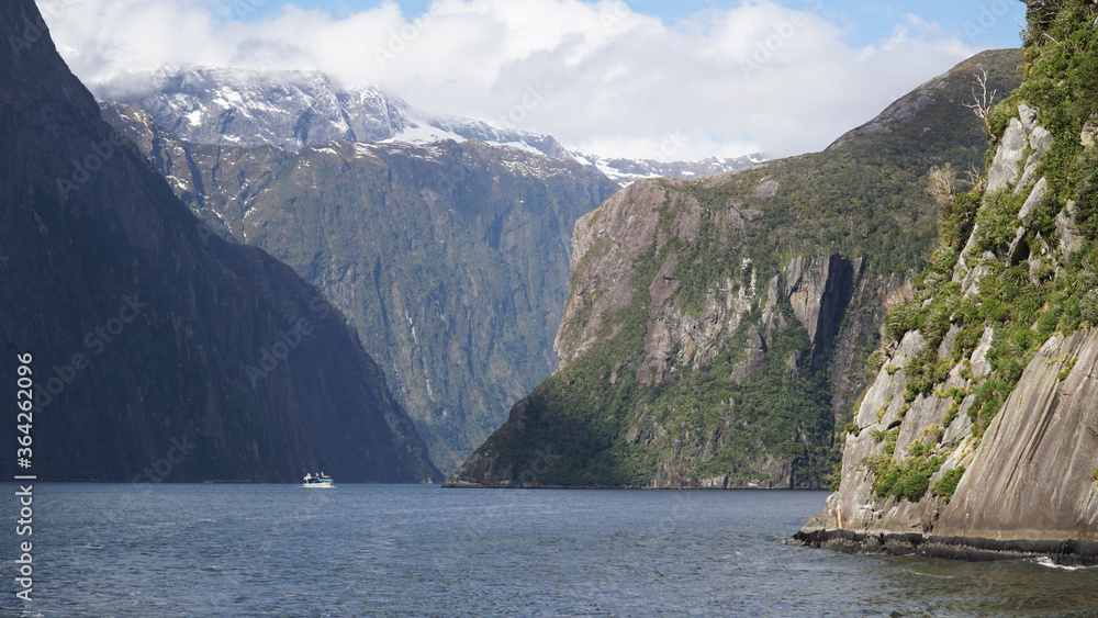 Steep mountain cliffs in Milford Sound Fiordland National Park, New Zealand. Steep mountain cliffs in Milford Sound Fiordland National Park, New Zealand.