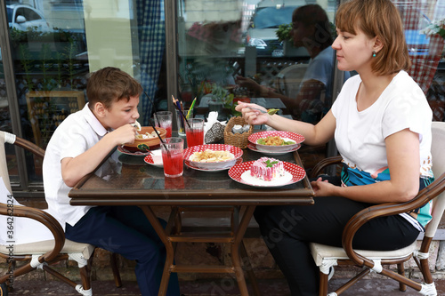 Mother and son have lunch