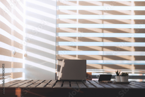 An empty home office view during early morning with beautfiful and modern lighting. photo