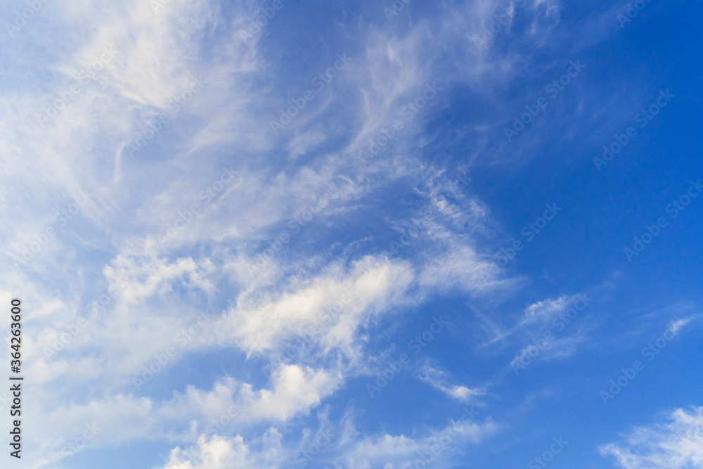 White clouds in beautiful deep blue sky background. Environmental and space exploration concept . White clouds in beautiful deep blue sky background. Environmental and space exploration concept .