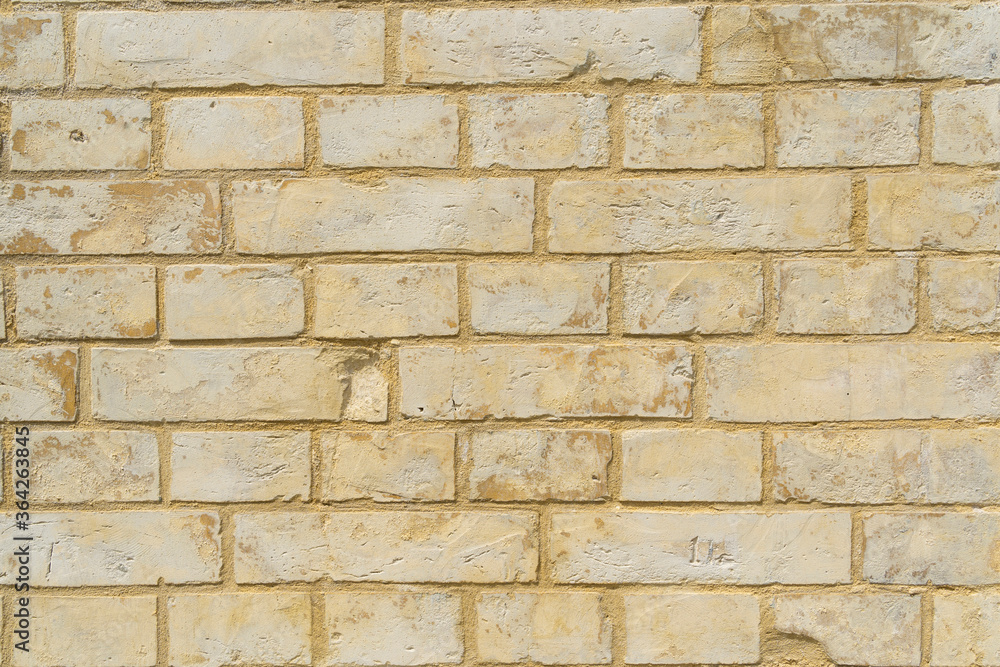Panoramic background of yellow brick wall texture. Home or office design backdrop. Panoramic background of yellow brick wall texture. Home or office design backdrop.