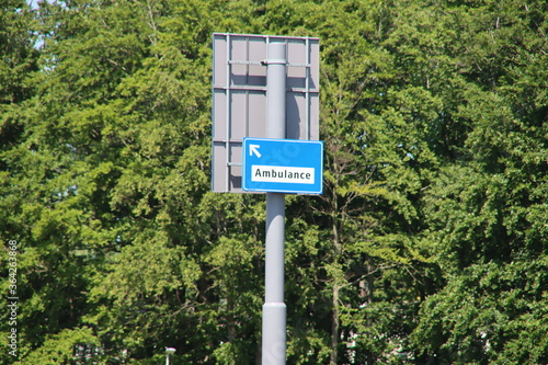 Direction sign in Blue and white heading the Emergency route for Ambulance entry of Maasstad Ziekenhuis in Rotterdam