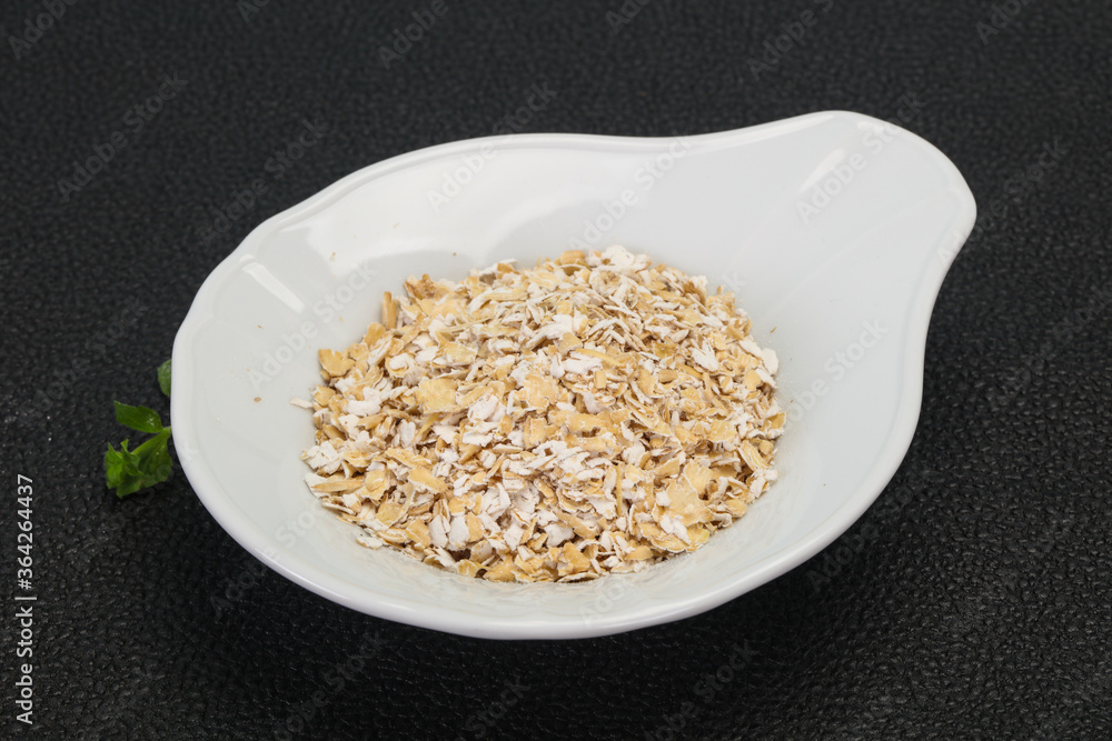 Raw oats in the bowl Raw oats in the bowl