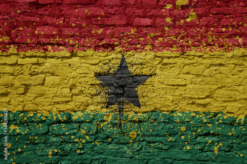 painted big national flag of ghana on a massive old brick wall