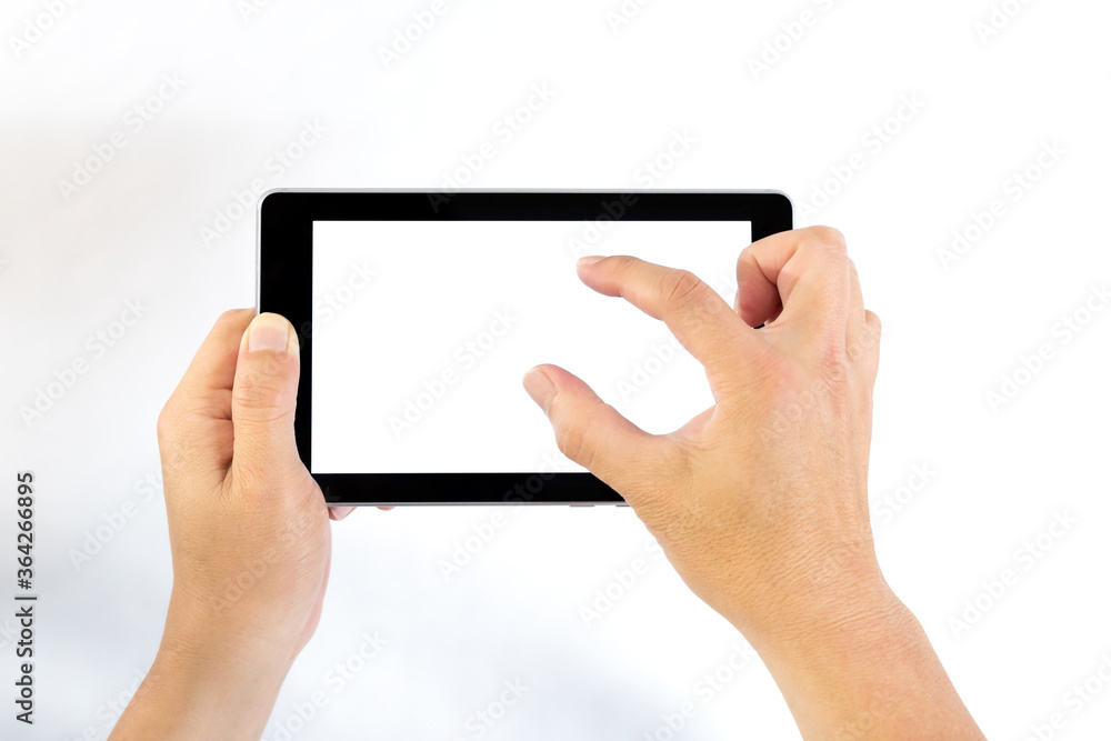 Middle aged man holding tablet computer in one hand and pinching to zoom tablet's screen on white background. Middle aged man holding tablet computer in one hand and pinching to zoom tablet's screen on white background.