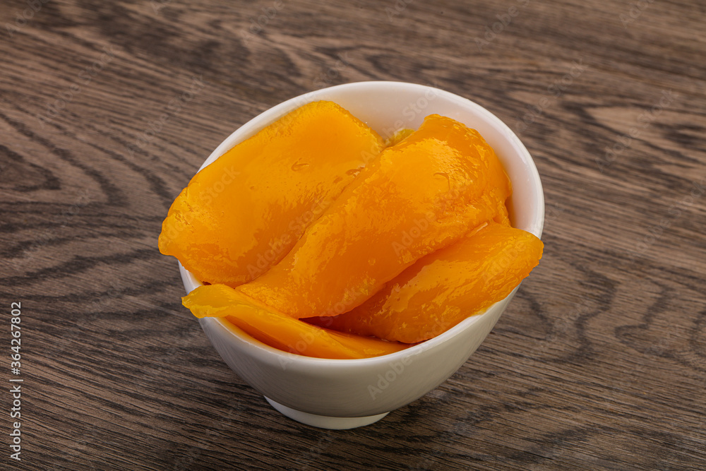 Sweet mango slices in syrop Sweet mango slices in syrop