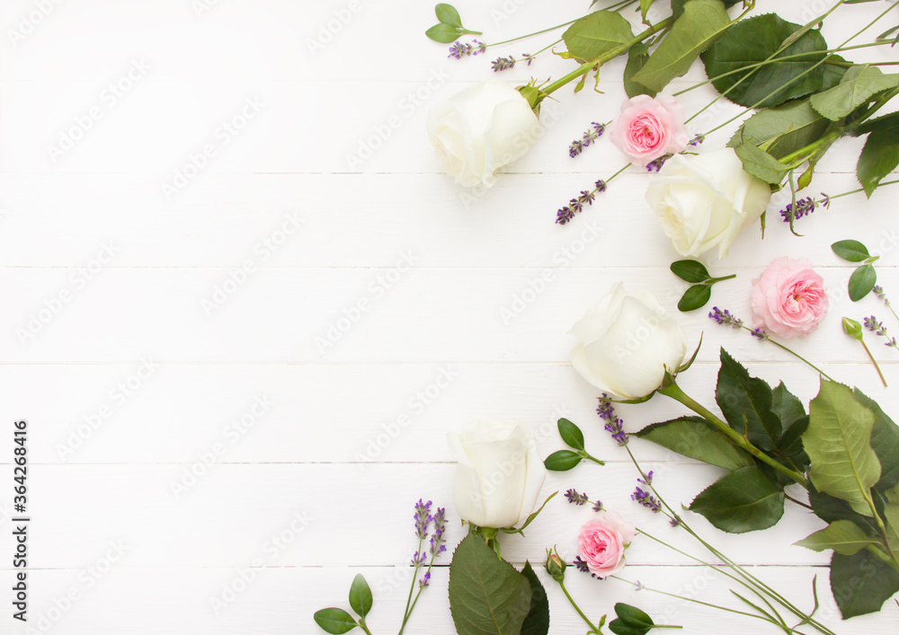 Fototapeta premium Flowers flat design. Pink and white roses and lavender flowers on white wooden board. Lavender mock up, provence template, lavender template for greeting cards