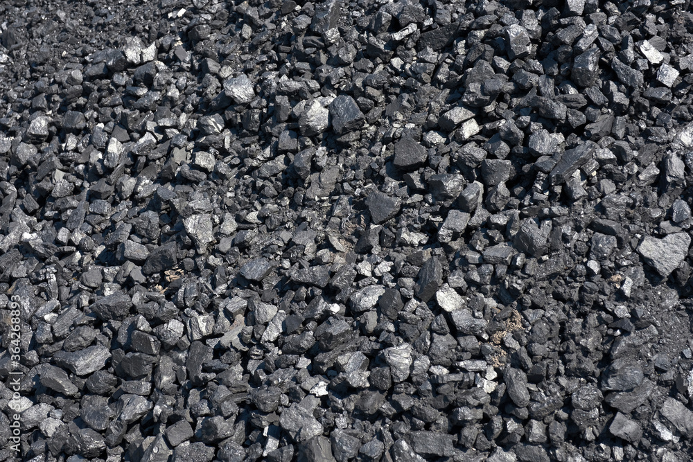 Pile of natural coal. Coal storage facility, top view. Pile of natural coal. Coal storage facility, top view.
