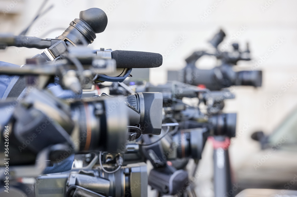 Details with television video cameras and recording equipment during a press event Details with television video cameras and recording equipment during a press event