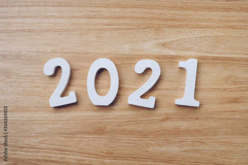 Business and design concept - wooden number 2021 for Happy new year text on wood table. Business and design concept - wooden number 2021 for Happy new year text on wood table.