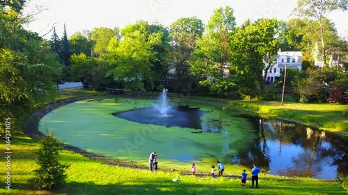 Pond with a Fountain - Pull Back Shot photo