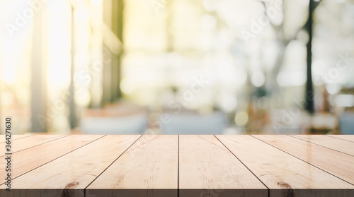 Empty wooden top table with blur coffee shop background