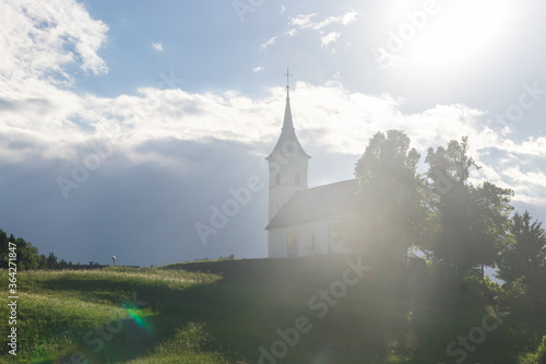 Church on hilld sun shining lens flare