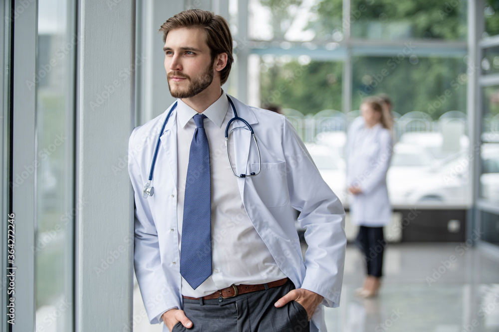 happy male medical doctor portrait in hospital. happy male medical doctor portrait in hospital.