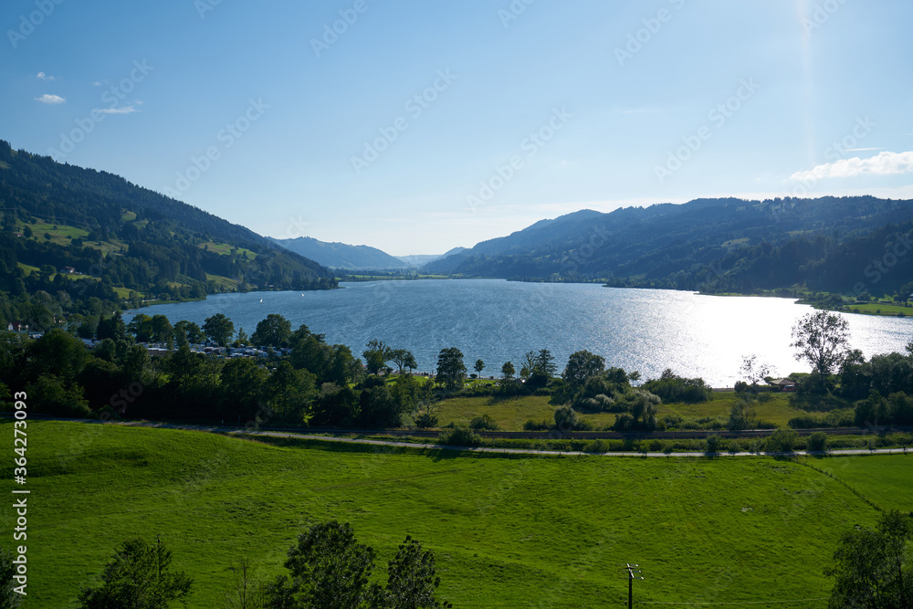 Sunny day at lake Alpsee in Immenstadt, Alps of Bavaria, overview of the lake