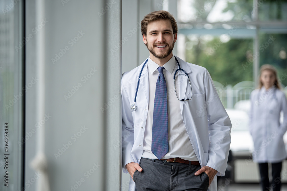 happy male medical doctor portrait in hospital. happy male medical doctor portrait in hospital.