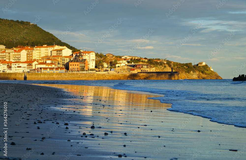 view of basque town Lekeitio and Karraspio beach at dawn