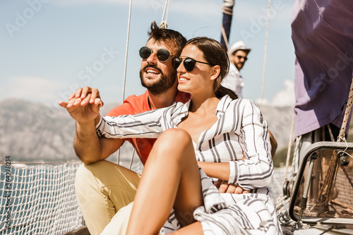 Loving couple spending happy time on a yacht at sea. Luxury vacation on a seaboat. © Mediteraneo
