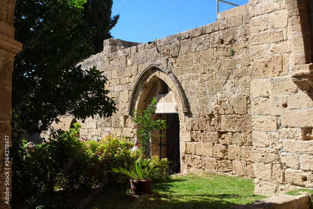 The arched entrance in the stunning Bellapais Abbey. White Abbey, the Abbey of the Beautiful world. Kyrenia. Cyprus...