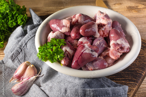 Fotografie Fresh raw chicken hearts