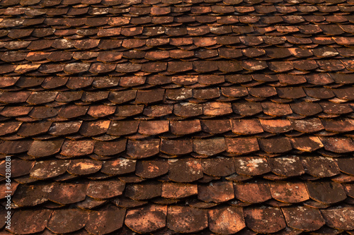 Texture of a roof with old roof tiles.
