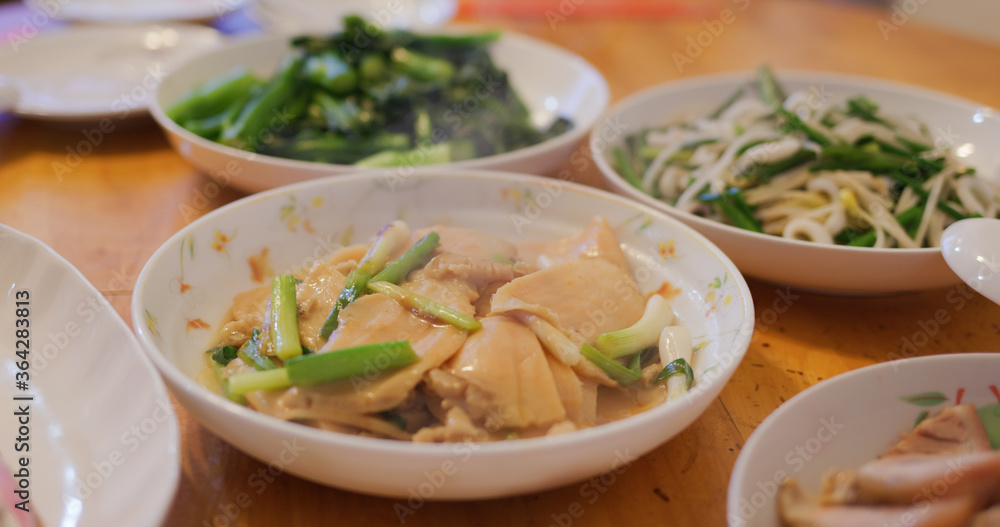 Hong Kong style home cuisine, family dinner concept, steamed fish, fry vegetable and meat Hong Kong style home cuisine, family dinner concept, steamed fish, fry vegetable and meat