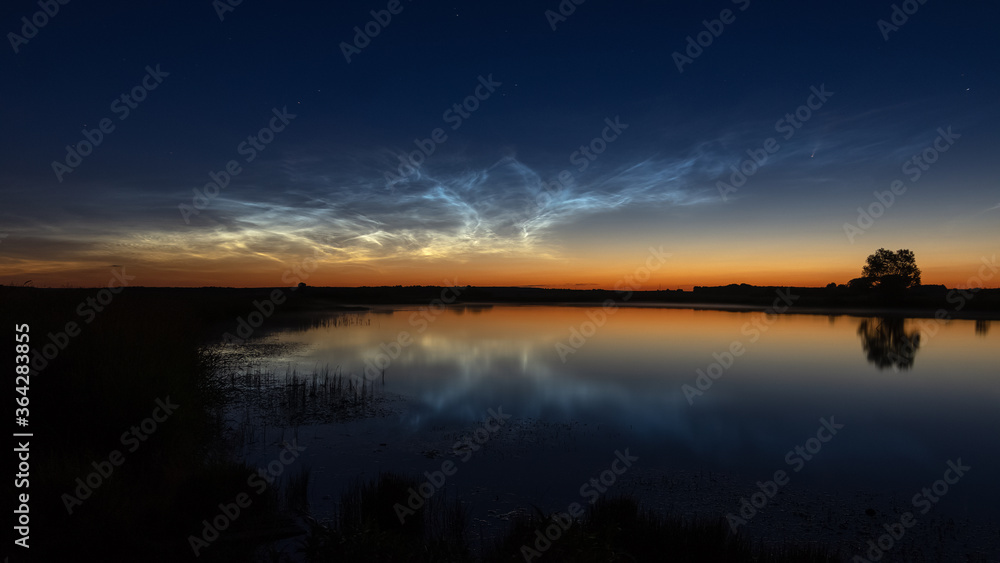 Ural landscape at night on the river with silvery clouds, Russia, Ural Sverdlovsk region