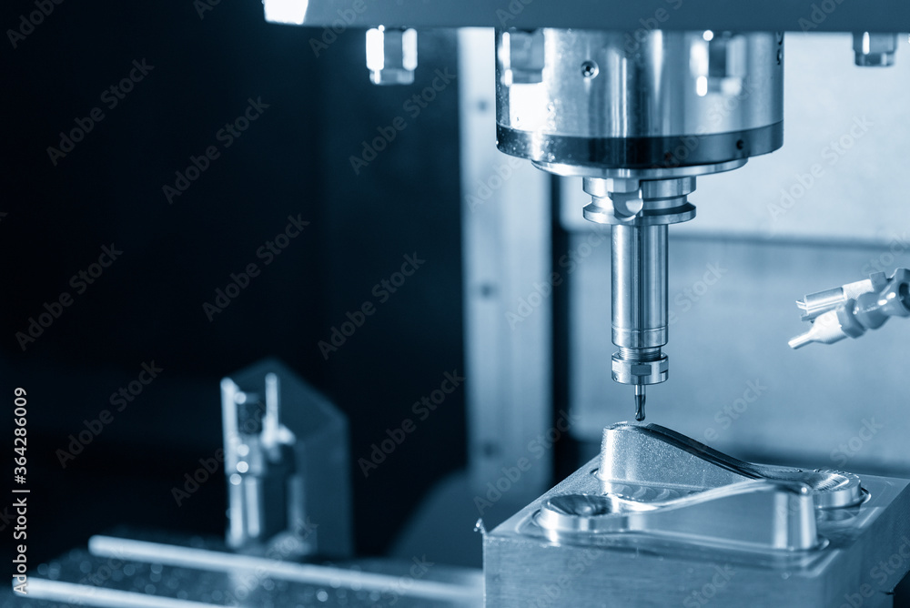 The CNC milling machine cutting the mold parts by solid endmill tool. The hi-precision mold and die manufacturing concept by machining center. The CNC milling machine cutting the mold parts by solid endmill tool. The hi-precision mold and die manufacturing concept by machining center.