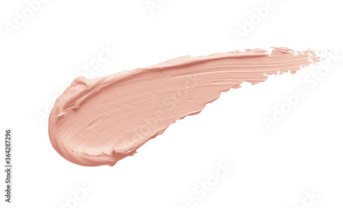 Foto Peachy pink color correcting concealer smear smudge swatch isolated on white background