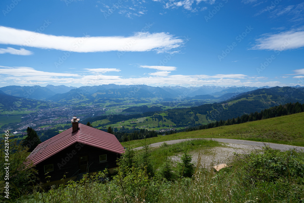 summer scenery view from the mittag mountain in bavaria, seeing a mountain hut