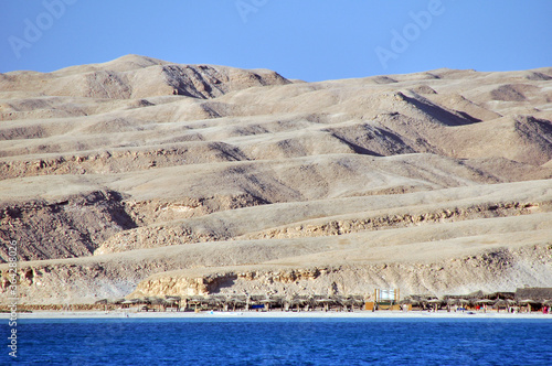 Deserted island in the Red Sea. The landscape of the Arabian desert is characteristic of the islands in the Hurghada region. photo